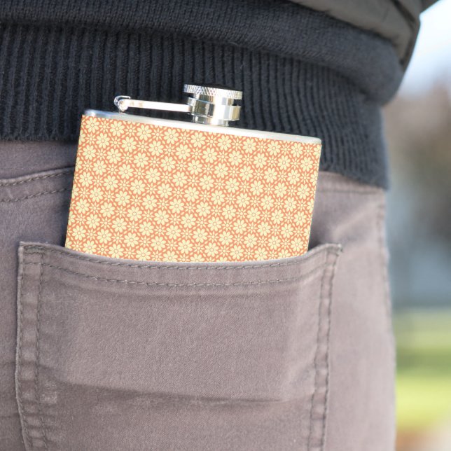 an orange and white background with a pattern hip flask (In Situ)