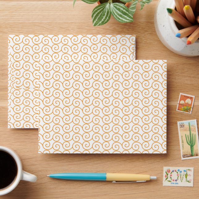 an orange and white background with swirls envelope (Desk)
