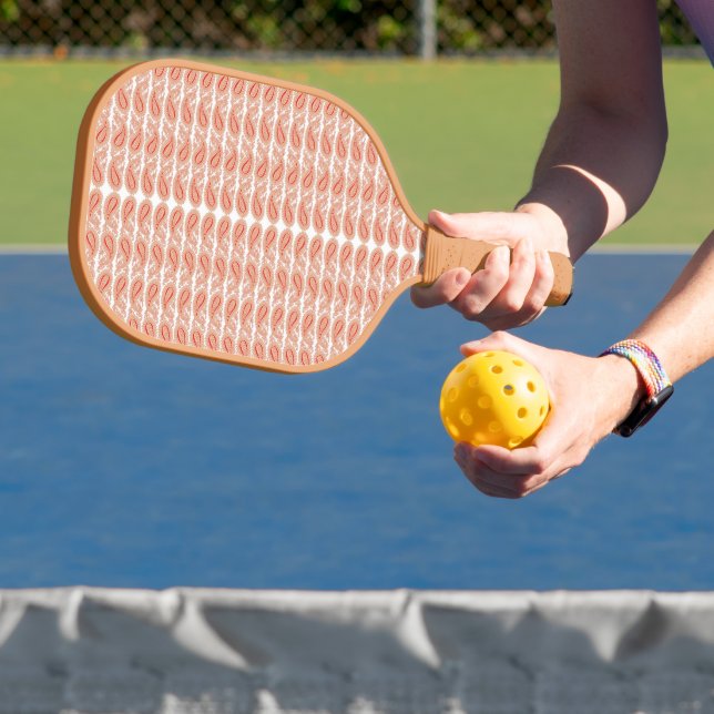 an orange and white pattern on a white background pickleball paddle (Insitu)