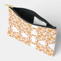 an orange and white wallpaper with a floral design