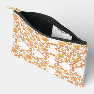 an orange and white wallpaper with a floral design accessory pouch