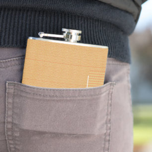 an orange and yellow background with small dots hip flask