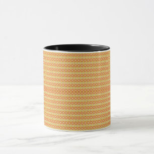 an orange and yellow background with small dots mug
