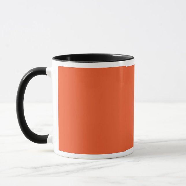 an orange background with a black border mug (Left)