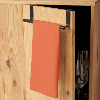an orange background with a tea towel