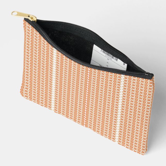 An orange rug with a textured pattern lies flat on accessory pouch (Open)