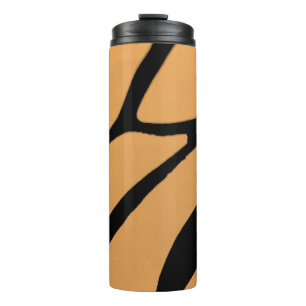 an orange surface with irregular black lines thermal tumbler