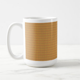An orange, yellow, and brown symmetrical pattern w coffee mug
