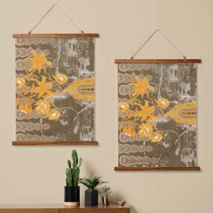 An ornate floral and leaf motif on a brown backgro hanging tapestry