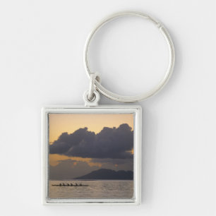 An outrigger canoe team practices off the coast key ring