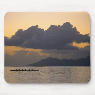 An outrigger canoe team practices off the coast mouse mat