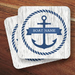 Anchor rope border boat name driftwood background coaster<br><div class="desc">Coasters featuring a dark blue nautical anchor surrounded by a rope border on a light gray driftwood background. Across the anchor is a blue ribbon with a template field for your boat's name or other custom text.</div>