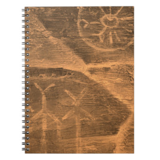 ancient design on the cave wall. history of antiqu notebook