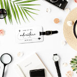 And So The Adventure Begins Black And White  Luggage Tag<br><div class="desc">Celebrate the beginning of your journey together with our "And So The Adventure Begins" Black and White Luggage Tag. These minimalist design luggage tags are perfect as a wedding or bridal shower favours, especially if you're embracing a honeymoon theme. Featuring elegant handwriting script and a modern aesthetic, they add a...</div>