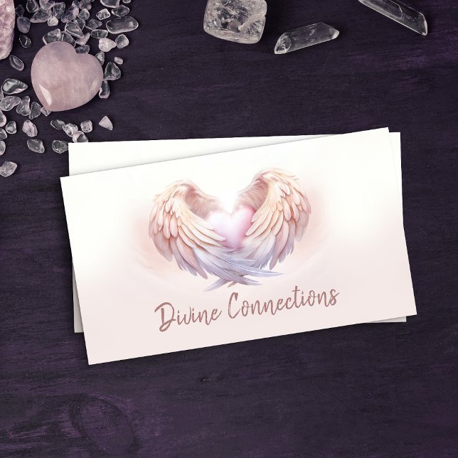 Angel wings gently embracing the heart business card (Creator Uploaded)