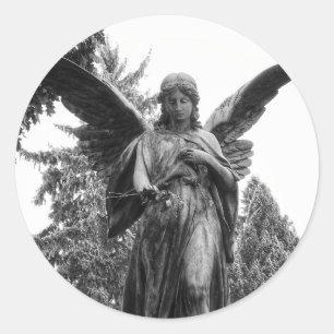 Angel With Spread Wings Holding A Flower Classic Round Sticker