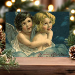 Angels A Merry Christmas Vintage Holiday Postcard<br><div class="desc">Beautiful vintage Christmas Angel Children postcard. "A Merry Christmas" greeting written in the lower right corner. This design features two beautiful children with angel wings sitting in the clouds in a loving embrace.</div>