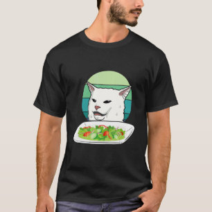 Angry women yelling at confused cat at dinner tabl T-Shirt