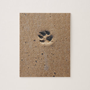 Animal paw prints in sand jigsaw puzzle