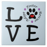 Animal Rescue Love Ceramic Photo Tile<br><div class="desc">This ceramic photo tile shows your love for animals and animal rescue. The word "love" is spelled with the letter O represented by a paw print with a red heart inside surrounded by the words adopt, foster and rescue separated with purple paw prints. This is a great gift for yourself...</div>