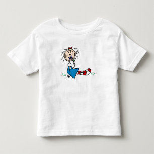 Annie Lying In Grass With Flower Shirt