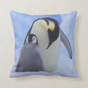 Antarctica. Emperor penguins and chick Cushion