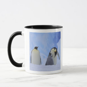 Antarctica. Emperor penguins and chick Mug