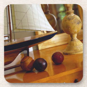 Antique Baseballs On A Table By A Model Sailboat Coaster