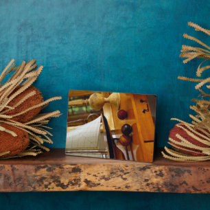 Antique Baseballs On A Table By A Model Sailboat Plaque