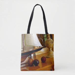 Antique Baseballs On A Table By A Model Sailboat Tote Bag