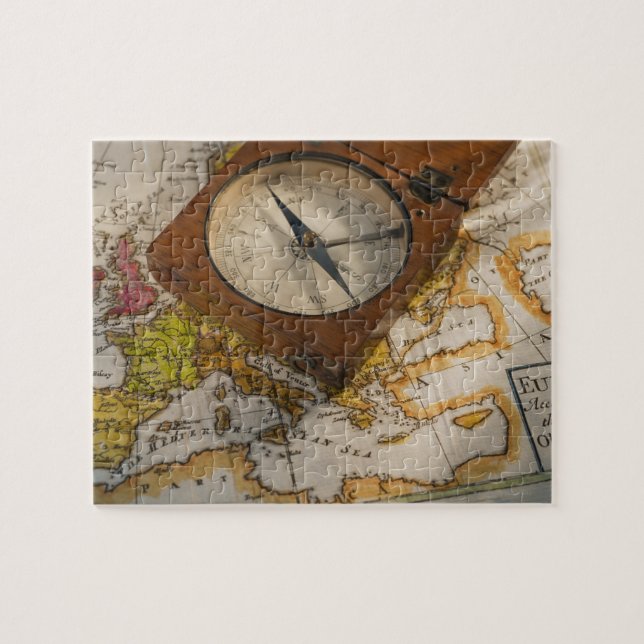 Antique compass on map jigsaw puzzle (Horizontal)