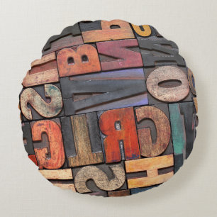 antique letterpress ing blocks with color ink pati round cushion