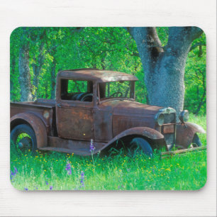 Antique rusted truck in a meadow mouse mat