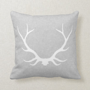 Antlers on grey linen cushion