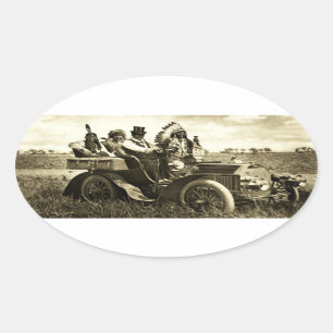 APACHES AND GERONIMO DRIVING A MOTOR CAR OVAL STICKER