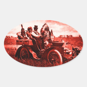 APACHES AND GERONIMO DRIVING A MOTOR CAR OVAL STICKER