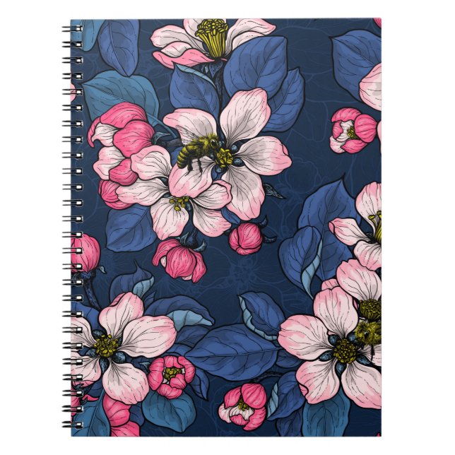 Apple blossom on a dark blue notebook (Front)