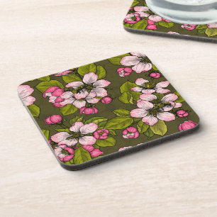 Apple blossom on dark green coaster