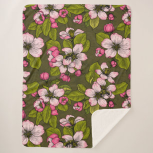 Apple blossom on dark green sherpa blanket