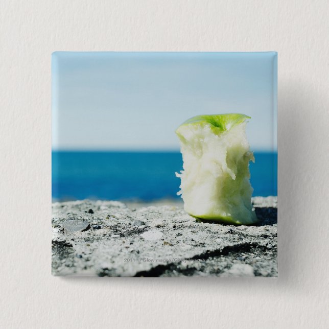 Apple core in the dirt 15 cm square badge (Front)