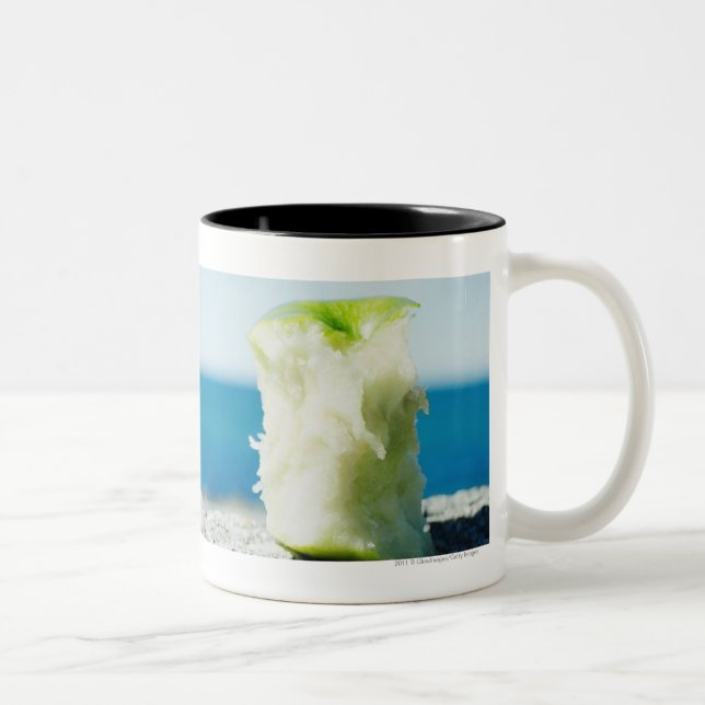 Apple core in the dirt Two-Tone coffee mug (Right)