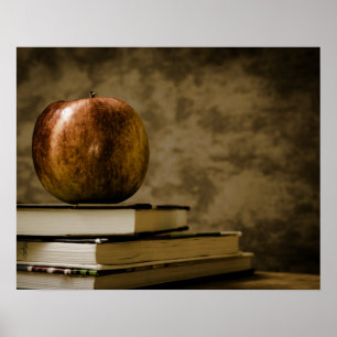 Apple on Top of a Stack of Books on a Desk Poster