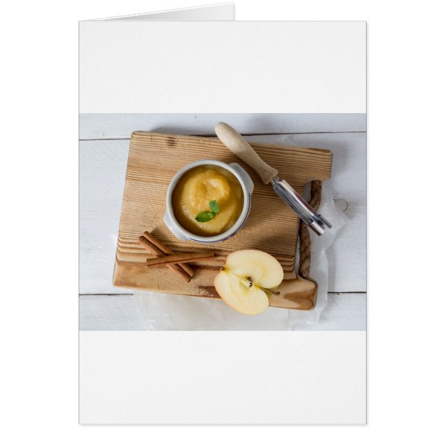 Applesauce with cinnamon in stoneware bowl (Front)