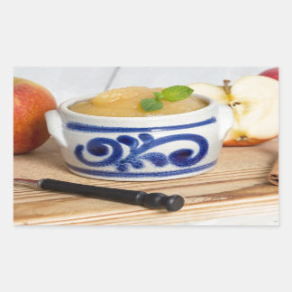 Applesauce with cinnamon in stoneware bowl rectangular sticker