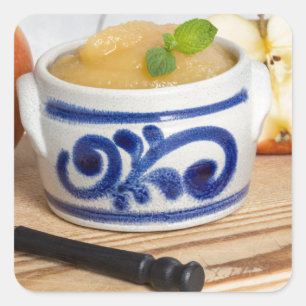 Applesauce with cinnamon in stoneware bowl square sticker