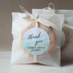 Aqua and Gold Beach Thank You Wedding Favour Classic Round Sticker<br><div class="desc">These aqua and gold beach calligraphy thank you favour stickers are perfect for a tropical destination wedding. The simple and modern design features stunning turquoise, teal and light blue watercolor with a soft gold sparkle reminiscent of the sand and sea. It's paired with gorgeous elegant calligraphy. Personalise the sticker labels...</div>