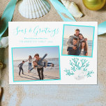 Aqua Blue Seas & Greetings Beach Christmas 2 Photo Holiday Card<br><div class="desc">This beach inspired Christmas card features two framed photos,  a white sand dollar and 2 white starfish on aqua blue glitter coral,  and “Seas & Greetings” in a trendy handwriting script font.</div>