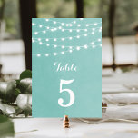 Aqua String Lights Wedding Table Numbers<br><div class="desc">Chic modern summer wedding table number card design with simple elegant glowing string lights hanging across the top and a classy mix of modern and calligraphy script fonts on a printed faux watercolor texture background. A simple and stylish preppy design, perfect for summer! Click the CUSTOMIZE IT button to customise...</div>