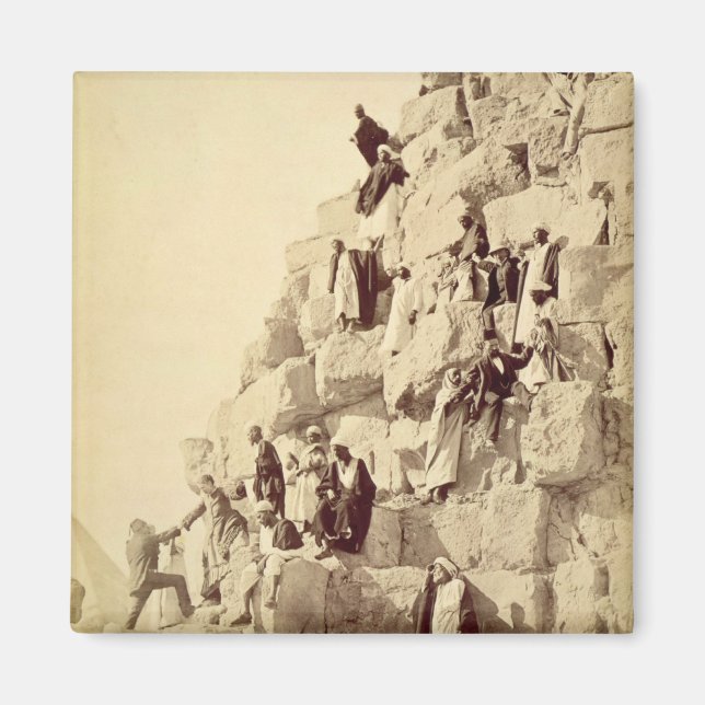 Arabs assisting tourists to climb the pyramids at magnet (Front)