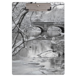 Arch Bridge over Frozen River in Winter Clipboard